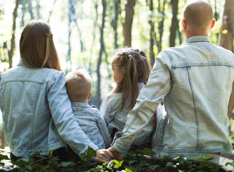 Photo of family sitting in scenic area